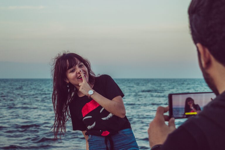 photo of a girl corporate joy in front of the sea